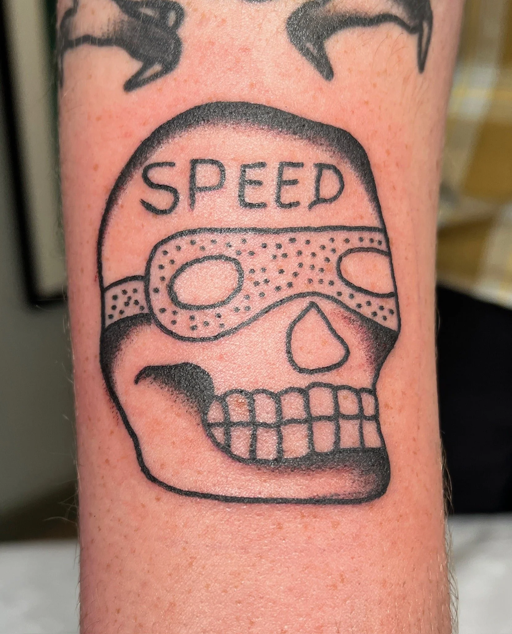 traditional-speed-skull-tattoo-arm.jpg