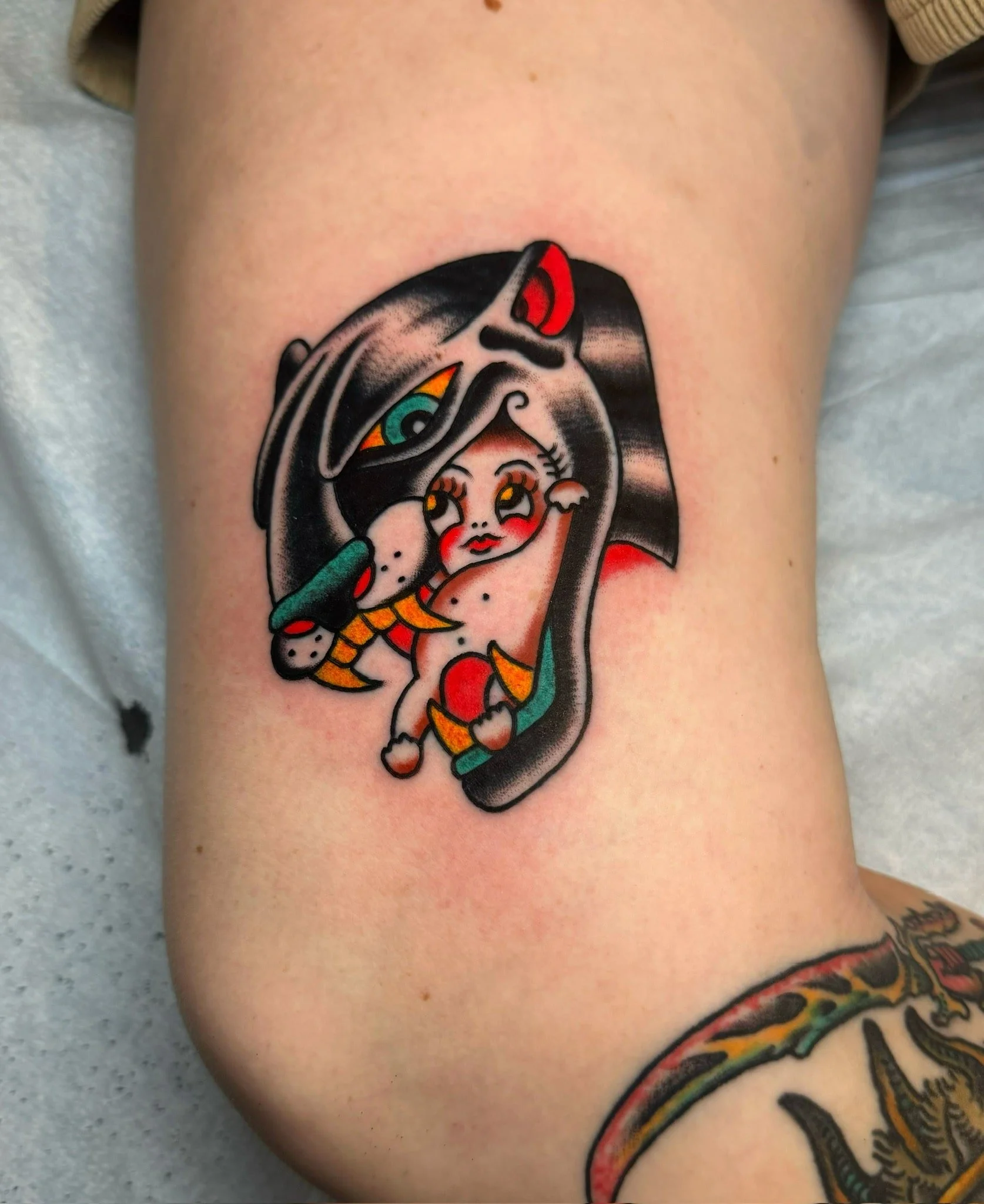traditional-panther-head-with-kewpie-tattoo-thigh.jpg