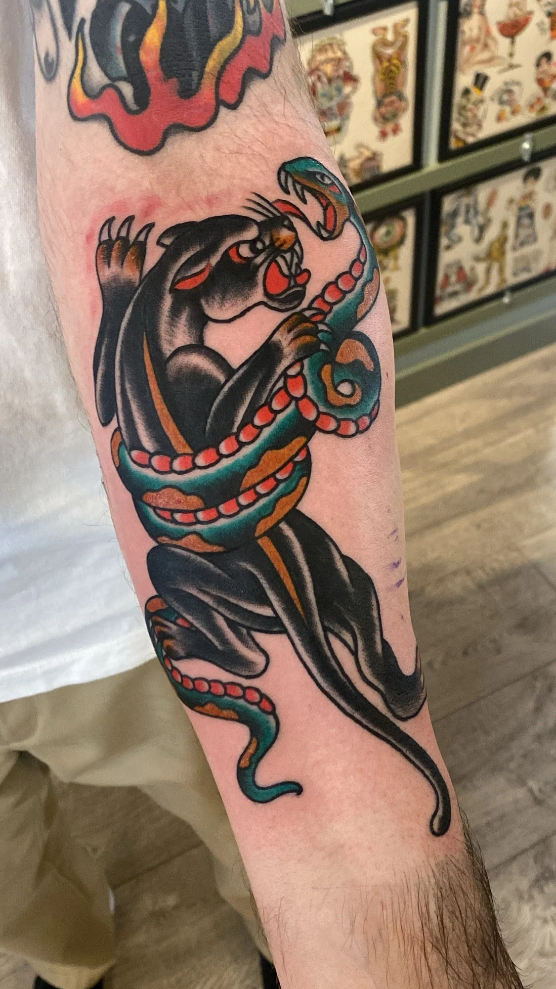 traditional-panther-vs-snake-tattoo-arm.jmin.jpg
