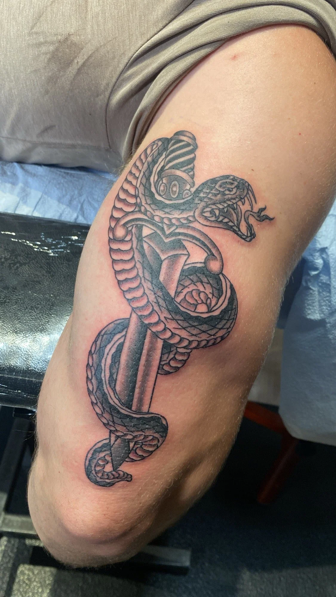black-grey-snake-wrapping-dagger-tattoo-arm.jpg
