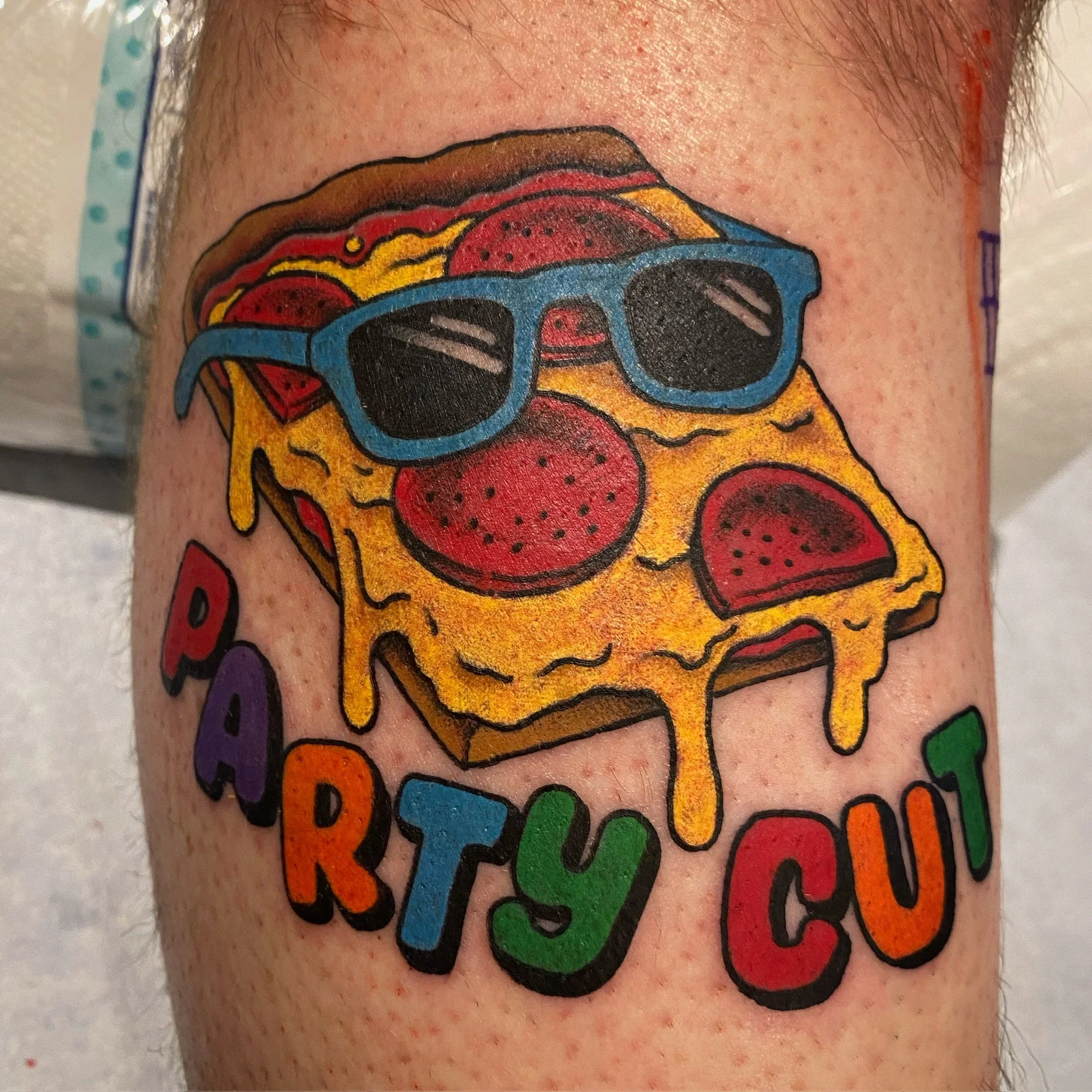 great-lakes-tattoo-chicago-traditional-pizza-slice-party-cut-tattoo.jpg.jpg