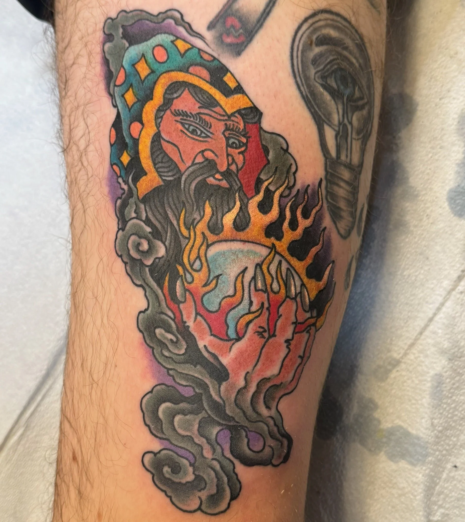 wizard-flaming-crystal-ball-traditional-tattoo-great-lakes-tattoo-chicago.jpg