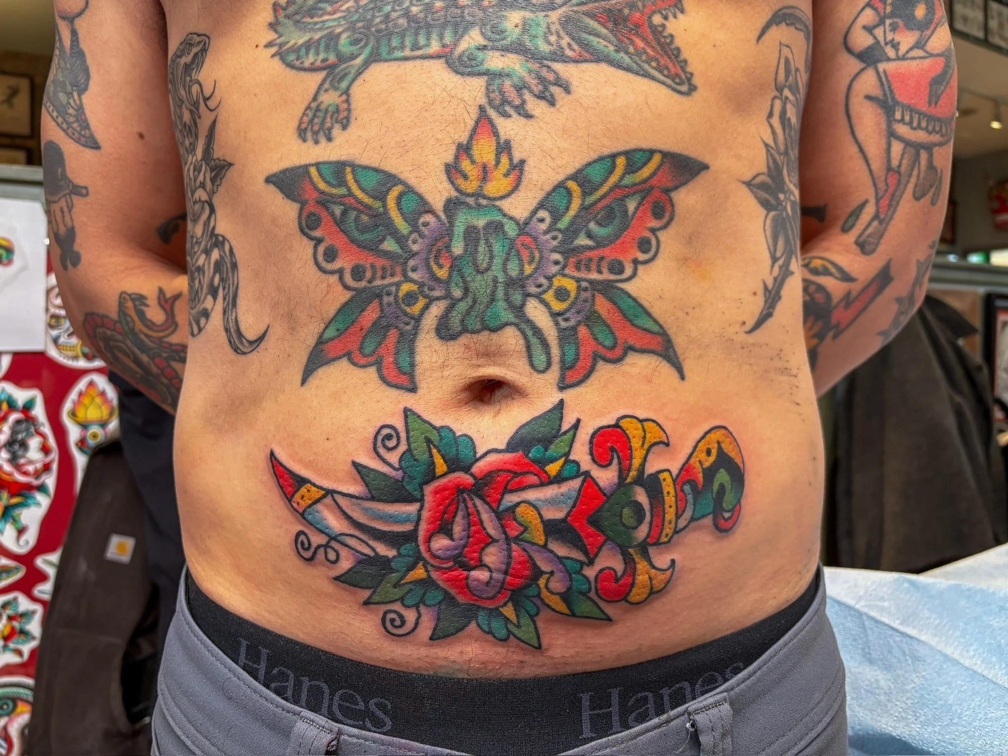 traditional-butterfly-dagger-rose-stomach-color-chicago-great-lakes-tattoo-min.jpg