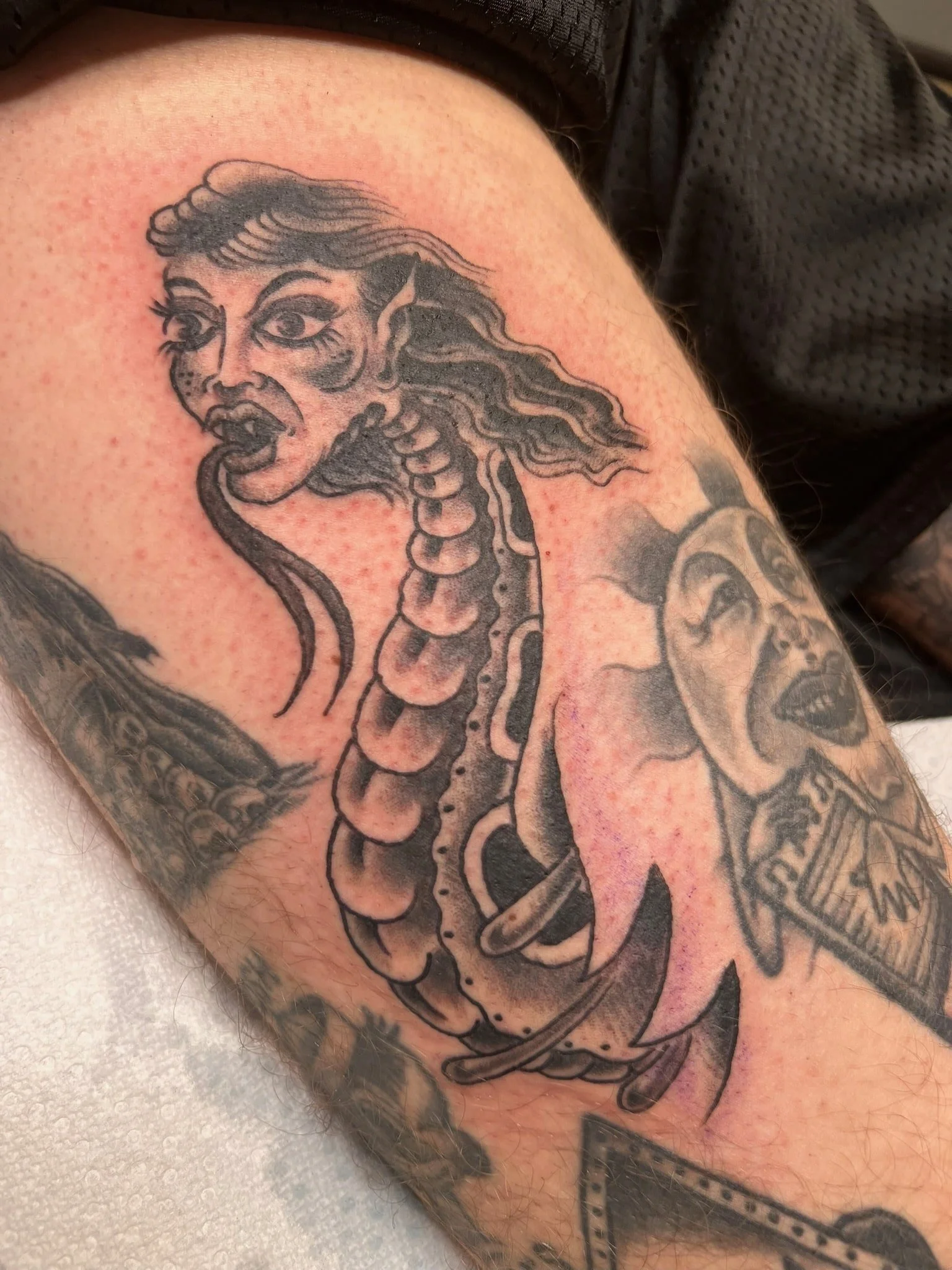 black-and-grey-serpent-woman-traditional-tattoo-great-lakes-tattoo-chicago.jpg