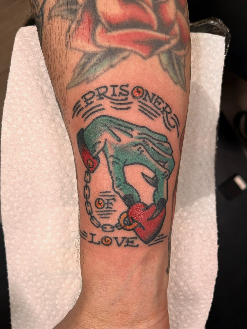 prisoner-of-love-hand-heart-traditional-tattoo-great-lakes-tattoo-chicago.jpg
