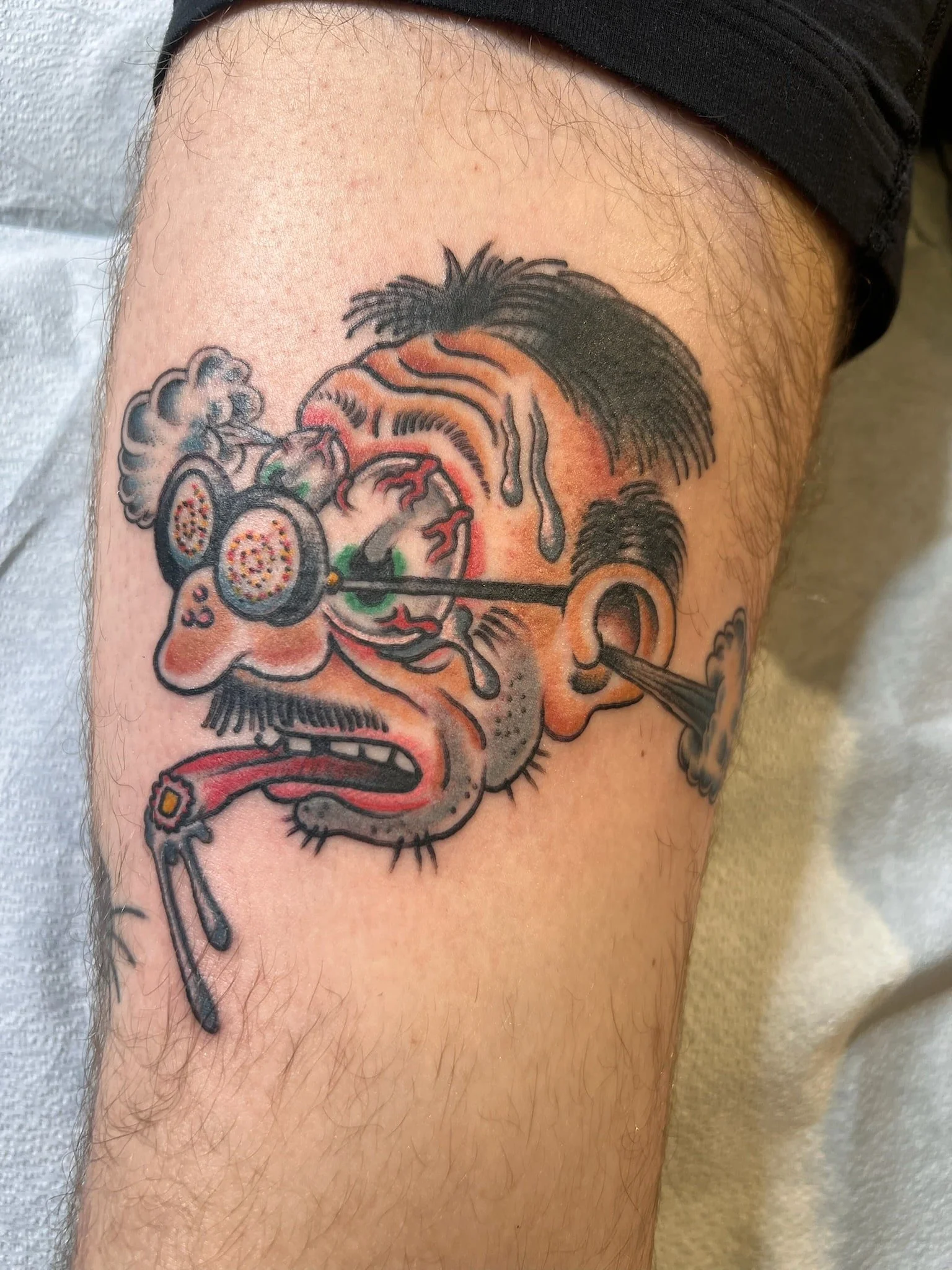 robert-crumb-head-lsd-traditional-tattoo-great-lakes-tattoo-chicago.jpg