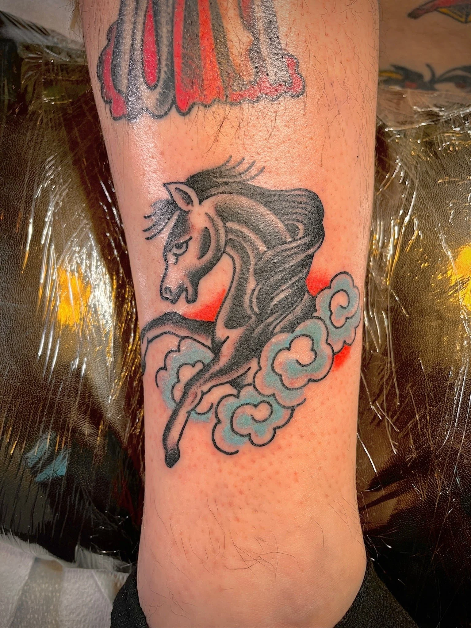 horse-clouds-traditional-chicago-great-lakes-tattoo-min.jpg