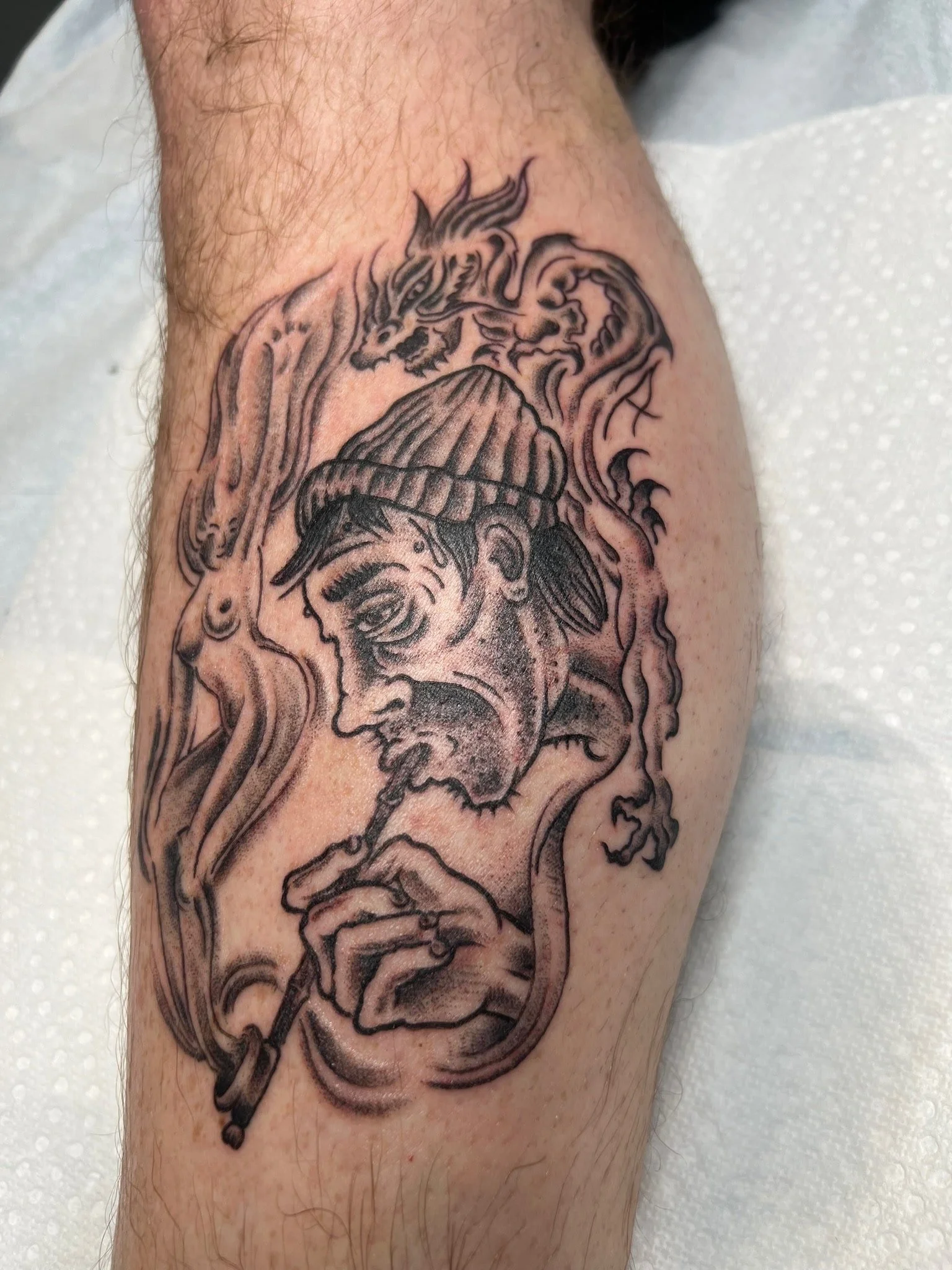 traditional-black-and-grey-smoking-man-tattoo-great-lakes-tattoo-chicago.jpg