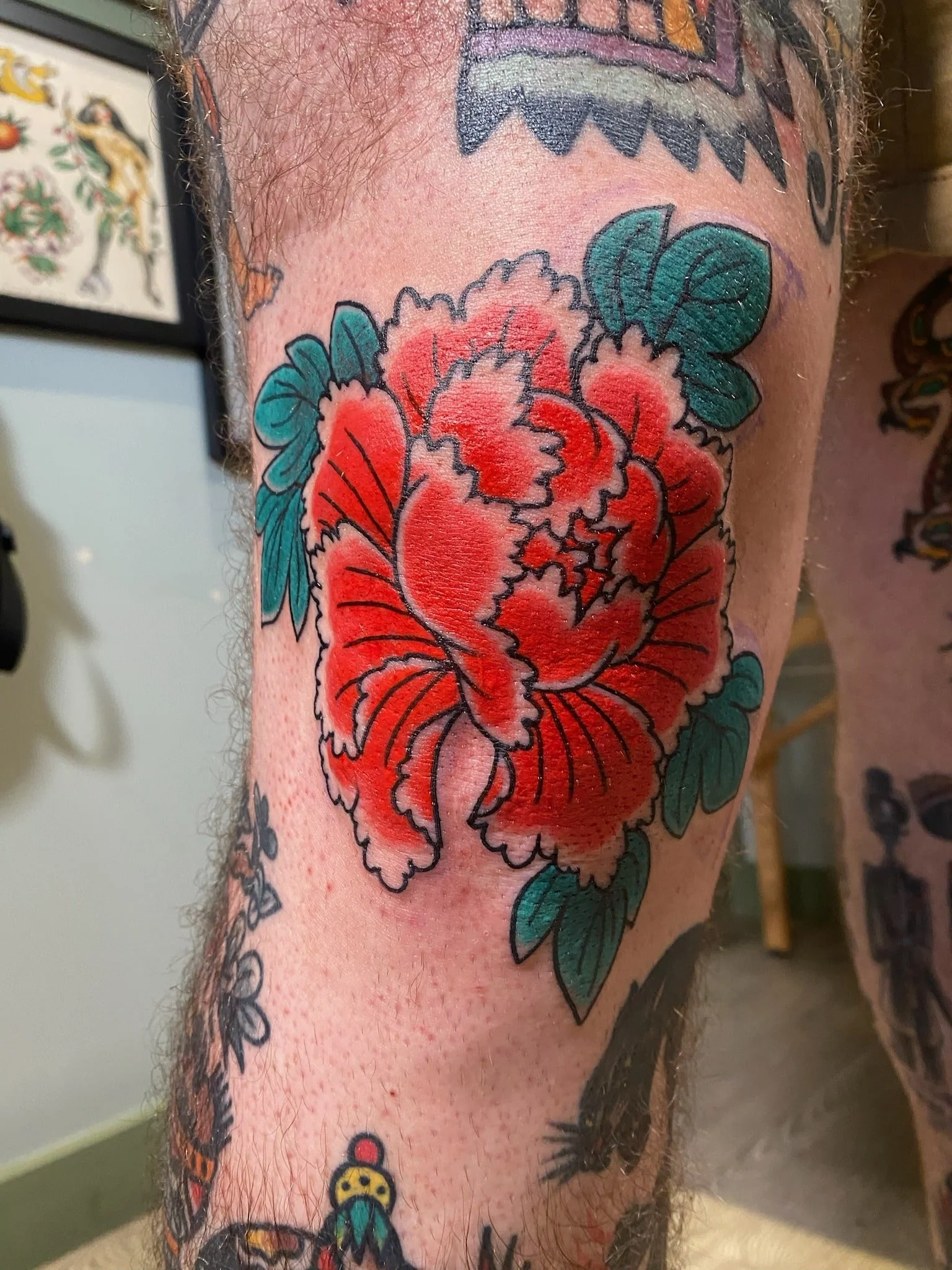 great-lakes-tattoo-chicago-traditional-peony-flower-knee-tattoo-min.jpeg