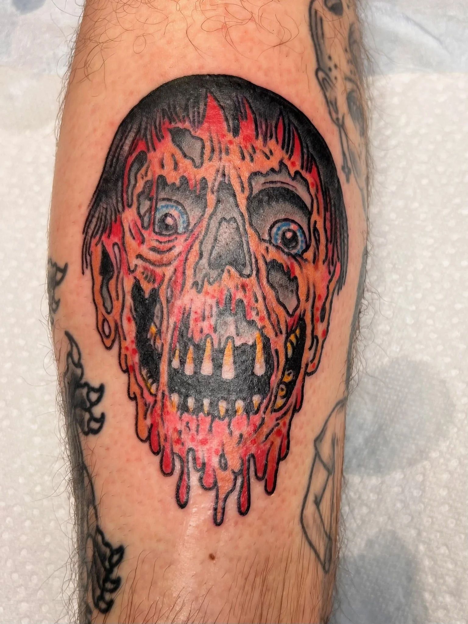 traditional-melting-skull-tattoo-great-lakes-tattoo-chicago.jpg