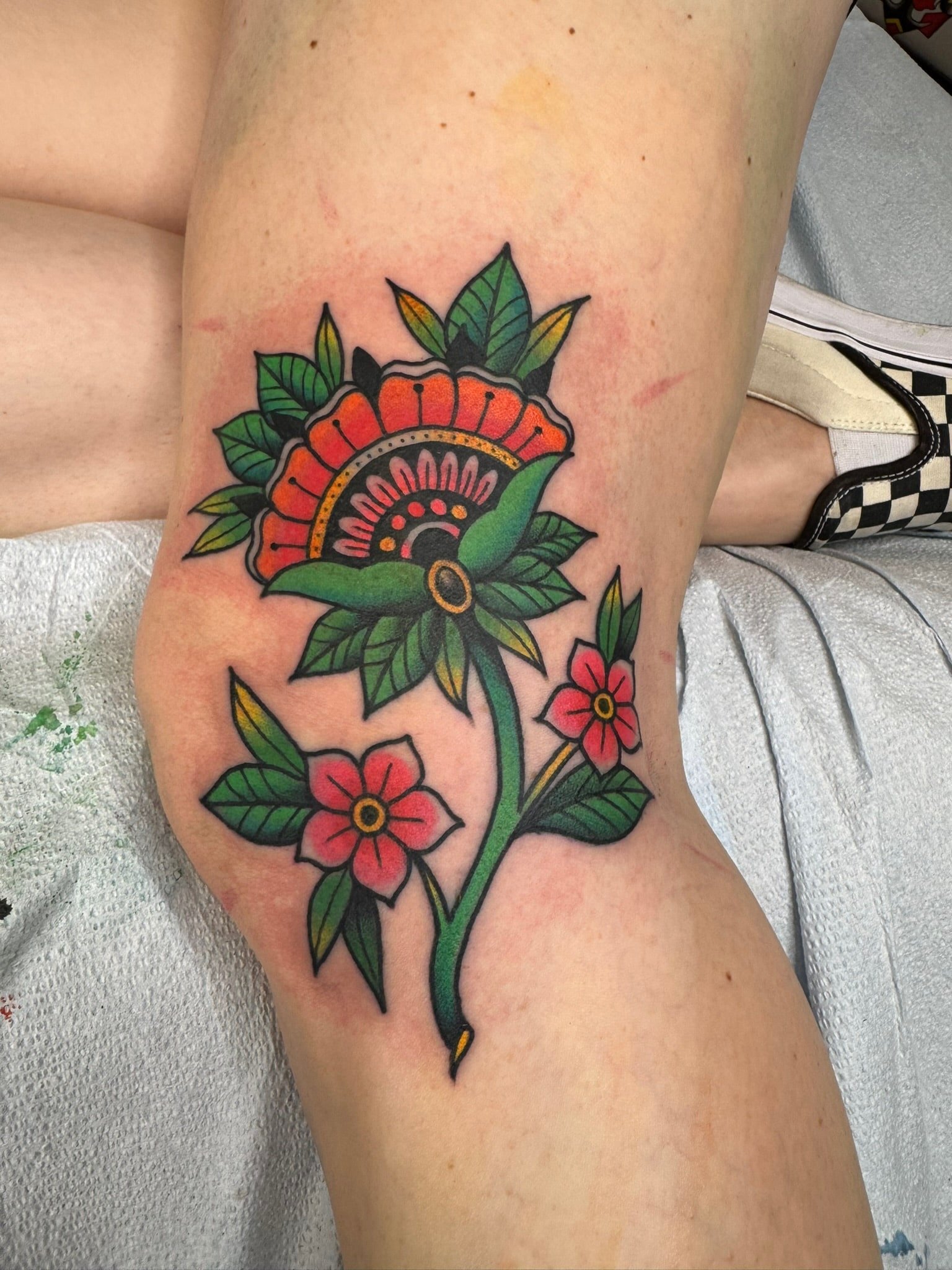 traditional-flower-leaves-tattoo-great-lakes-tattoo-chicago.jpg