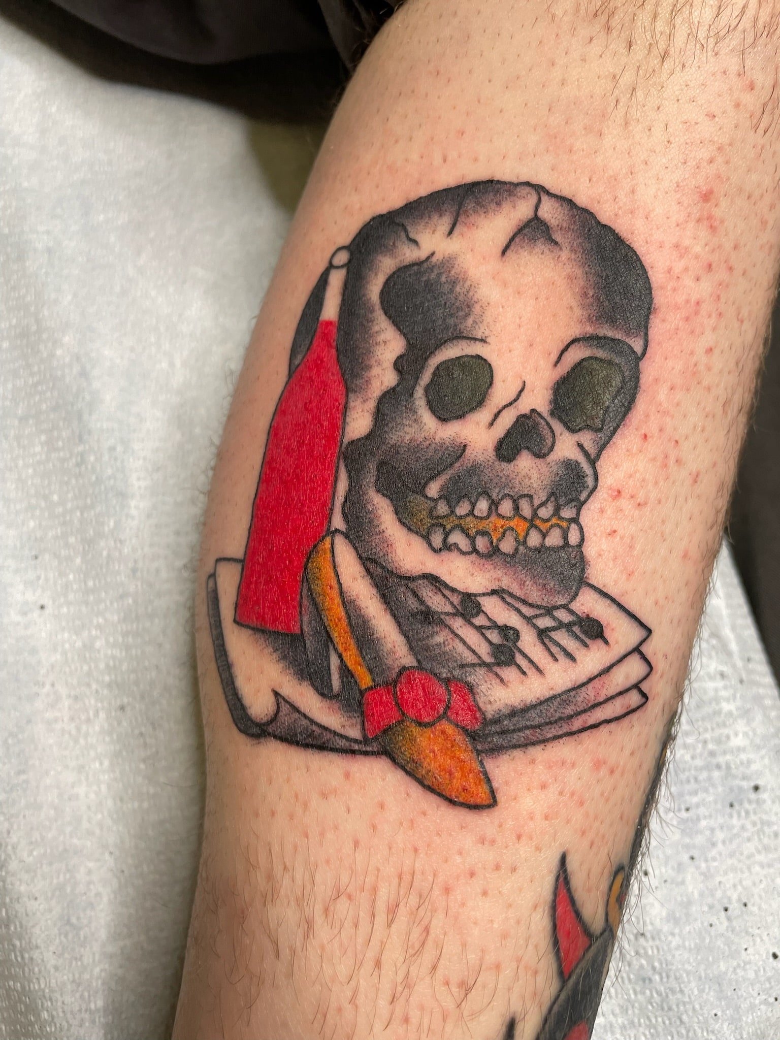 traditional-skull-book-dagger-chicago-great-lakes-tattoo-min.jpeg