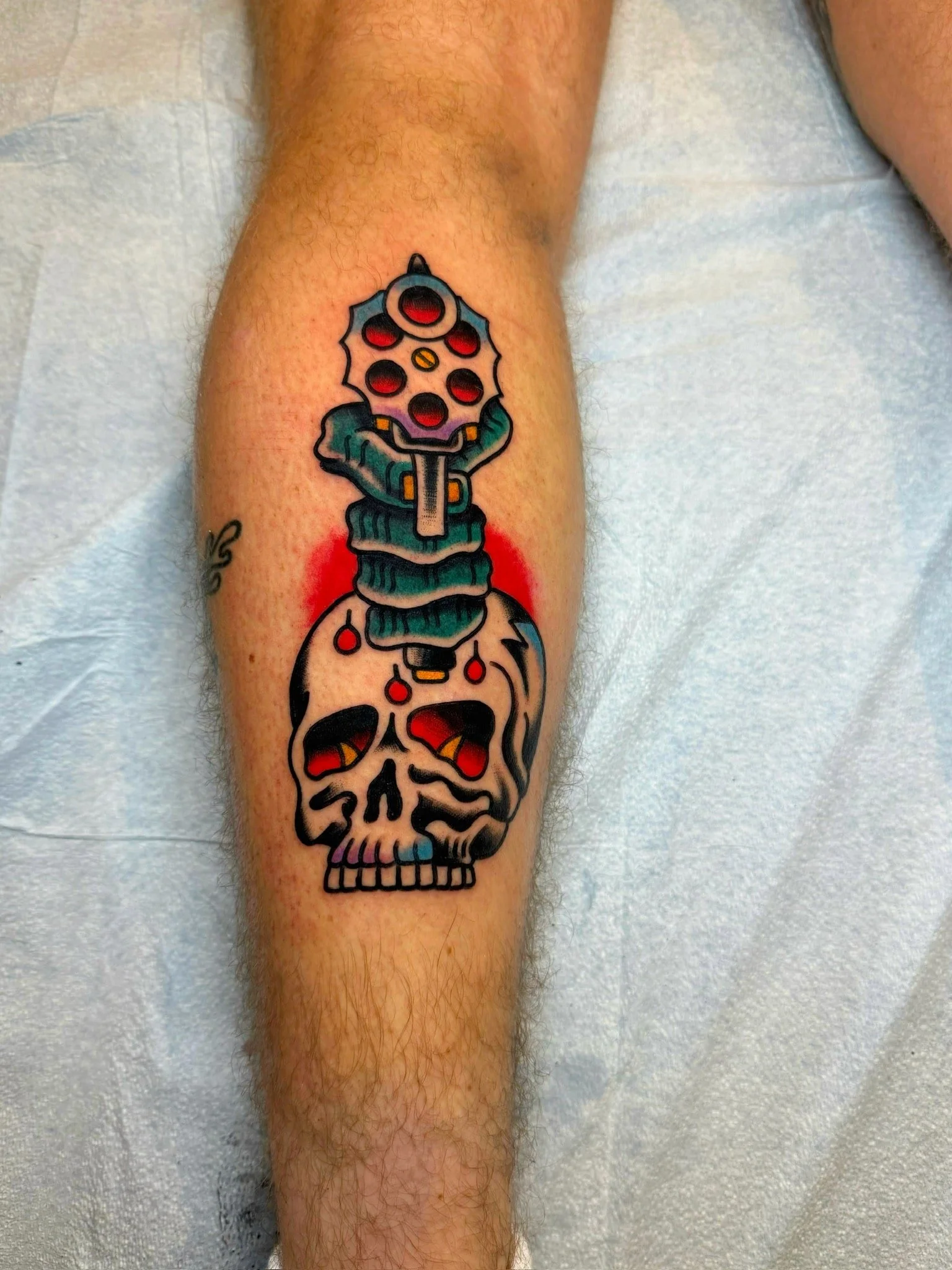 traditional-revolver-skull-chicago-great-lakes-tattoo-min.jpeg
