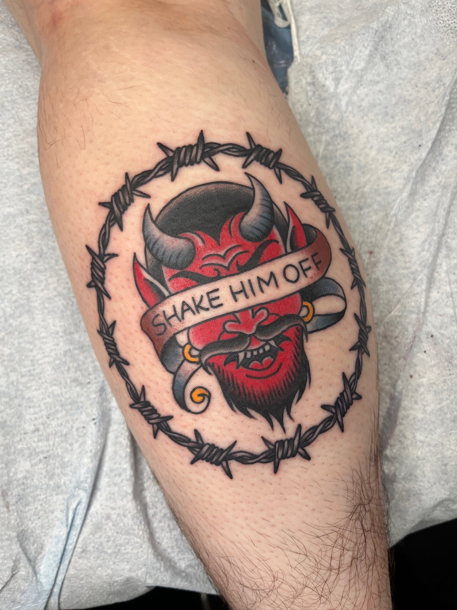 great-lakes-tattoo-chicago-traditional-oni-mask-barbed-wire-tattoo-min.jpg