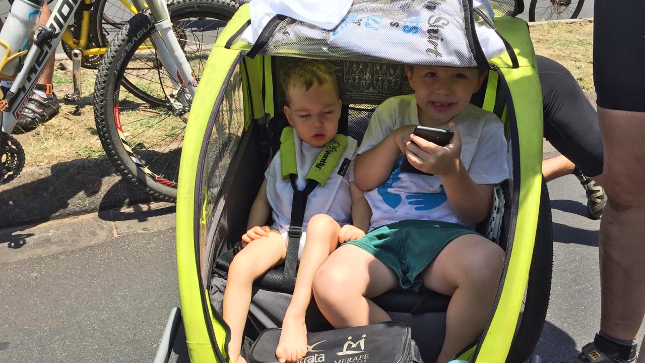 2 kids in chariot.jpg