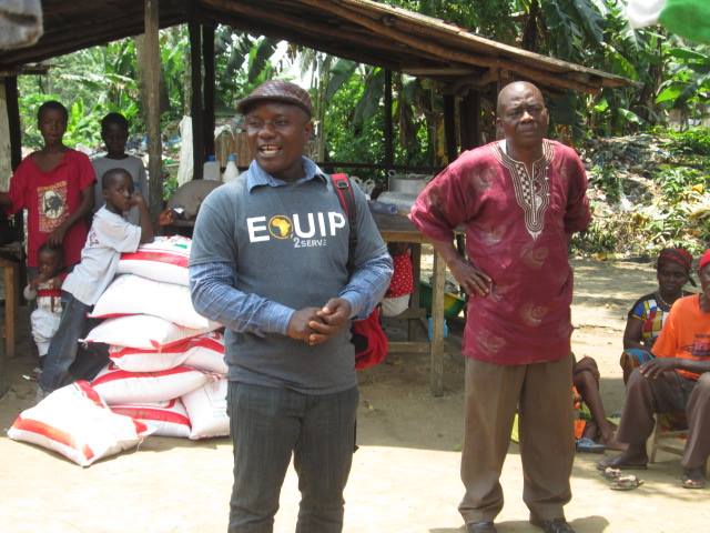  Pastor Philip Davis helping with the distribution of rice