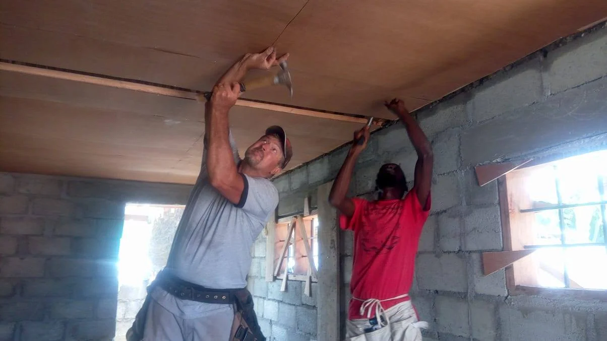 Pete Doerksen & Hope nailing up the ceiling.