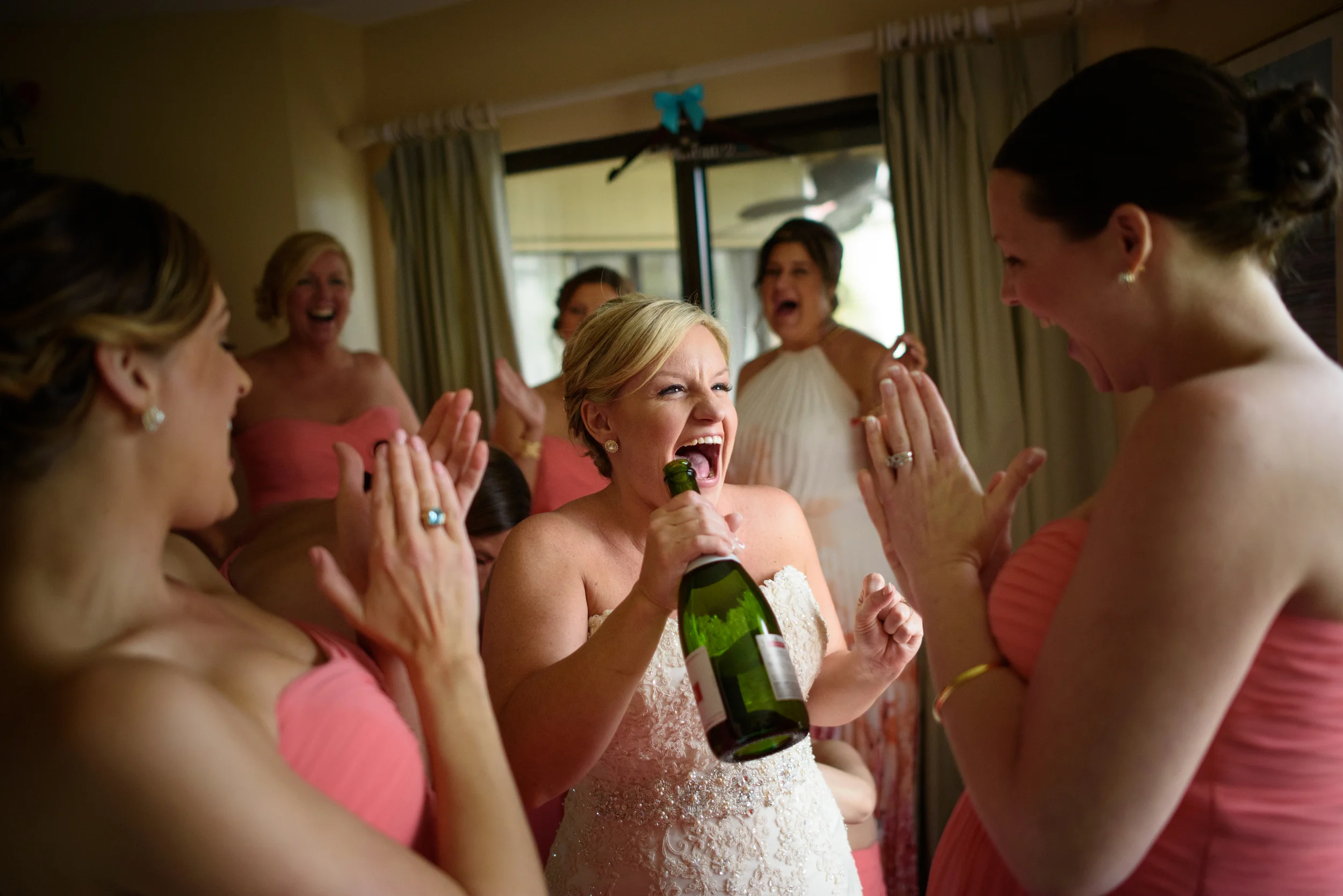 bride celebrates with her bridesmaids at the wedding