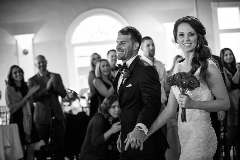 a bride beams during her intoductions