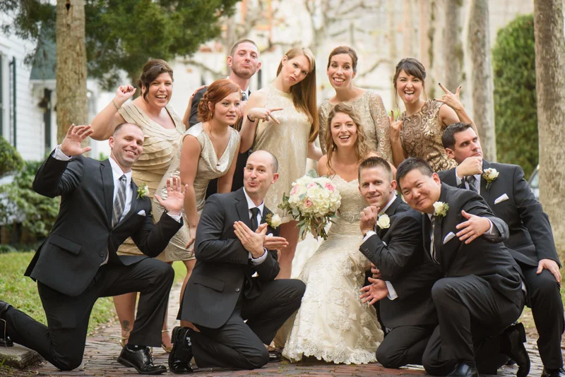 a fun bridal party photo just outside of the White Room in St. Augustine, Florida