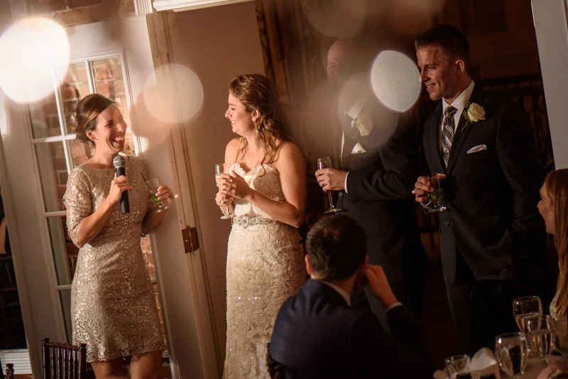 a bride cries as she is toasted by her maid of honor at the White Room in St. Augustine, Florida