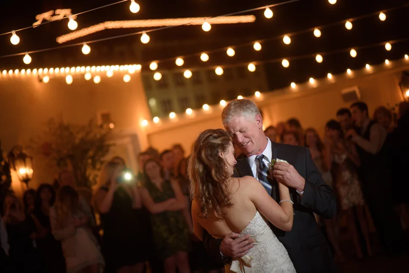 a bride dances with her father on the rooftop at the White Room in St. Augustine, Florida