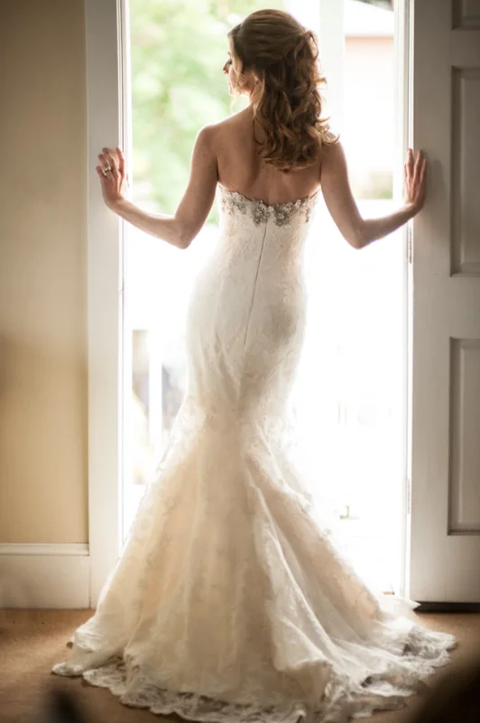 a bride shows off her amazing dress at the White Room in St. Augustine, Florida