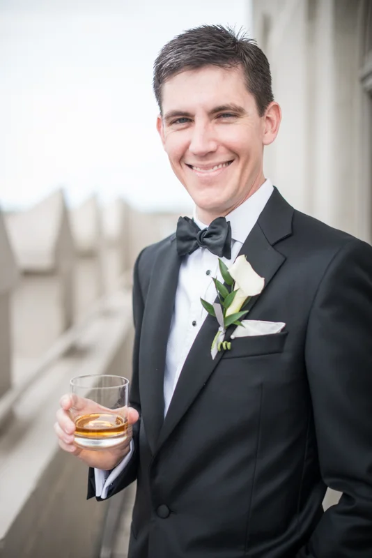 a groom takes a moment to enjoy his wedding day at the White Room in St. Augustine, Florida
