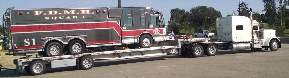 Squad 1 is loaded on a low-boy and secured bound for it's new home in Greenville, NY.
