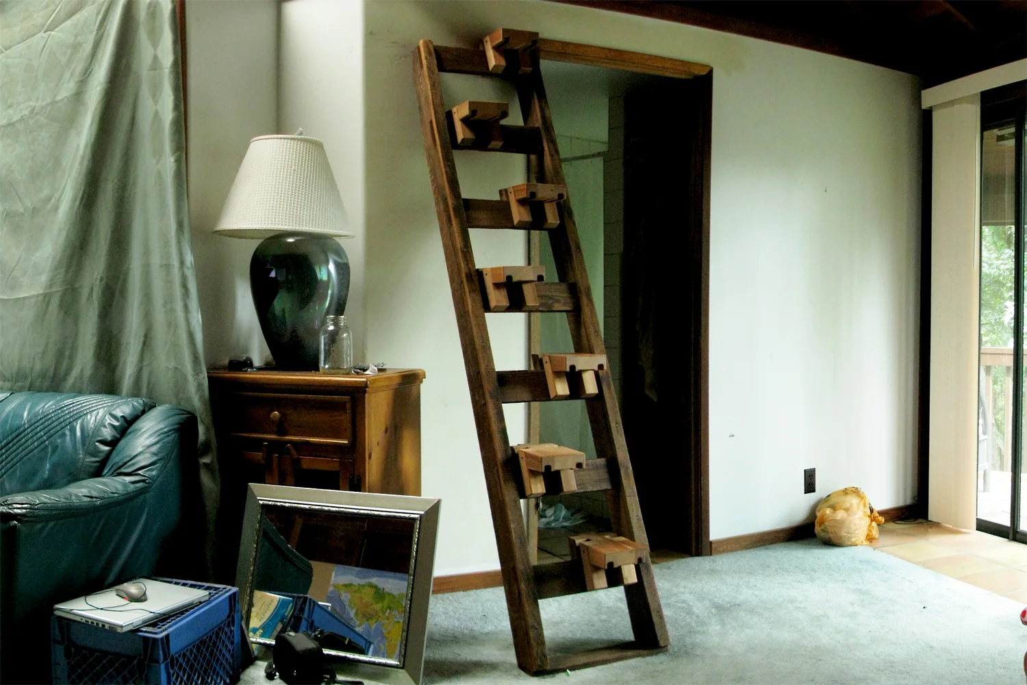 Since the ladder came with the cottage, which was a rental, I wanted to make sure I didn't ruin anything of sentimental value. I built the stair treads to fit onto the ladder rungs without damaging them. The property owner ended up loving the ladder/staircase I made, and said I could do whatever I wanted with the place. The next on the list was a headboard. 