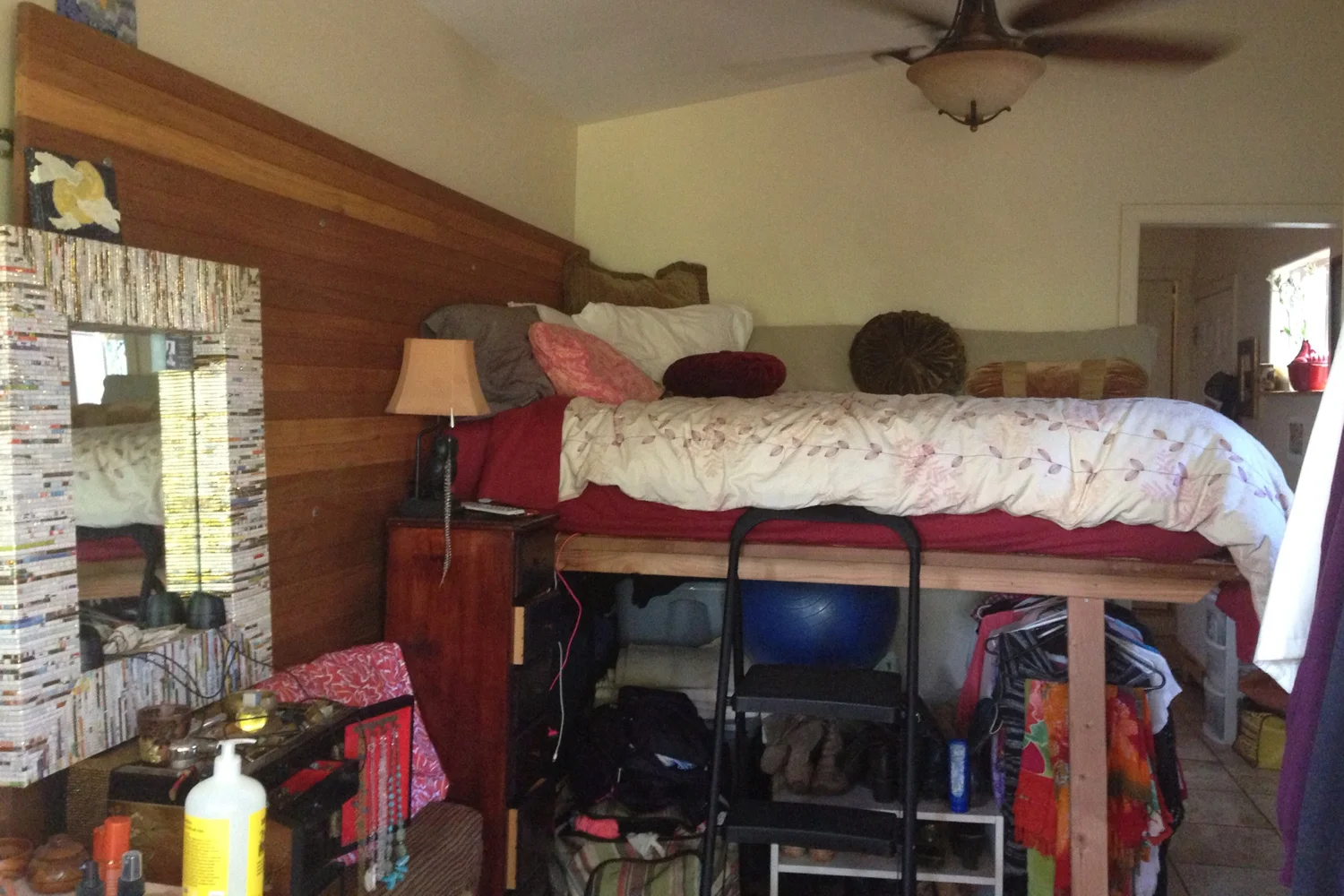 This is the bedroom/living room area. In a small space it is important to utilize both the height and the width of the room. The bed was raised to create a full closet; equipped with a hanging rod for clothes