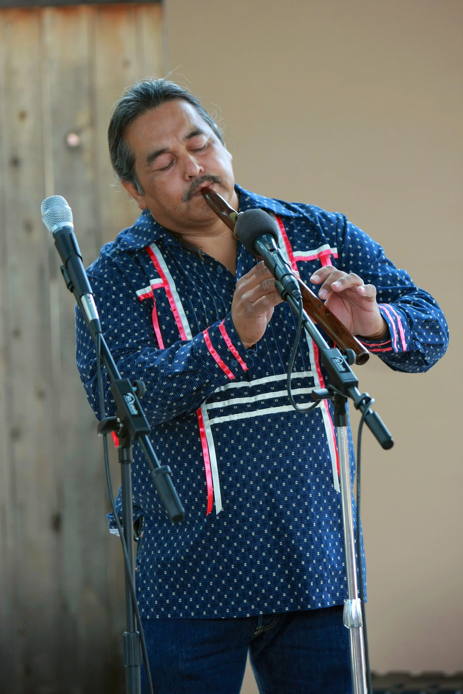 Alex Maldonado plays a flute made from river cane.