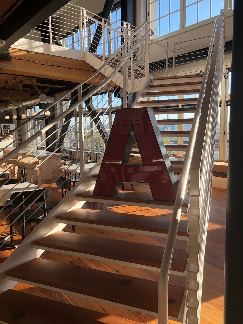  Image from the event space, depicting a capital “A” on the staircase to the 2nd level of Artefact. 