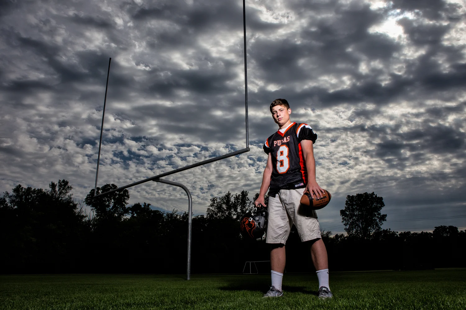 Yes, sports portraits are definitely my favorite! Especially with clouds like this! I used a single off camera strobe to light Tyler as I exposed for the sky. Without using off camera flash, the sky would be blown out and less dramatic. 
