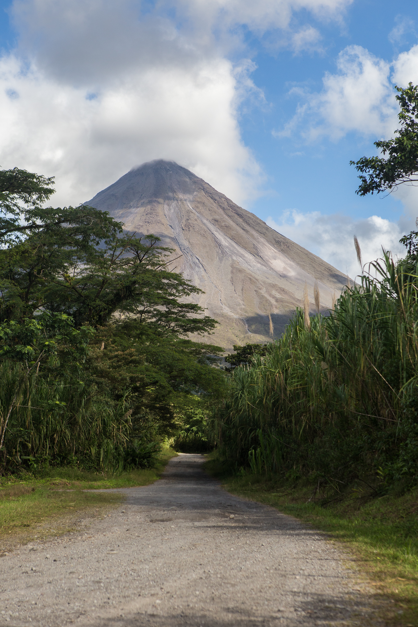The dirt road entrance at Arenal National Park. You can see the lava trails down the volcano.
