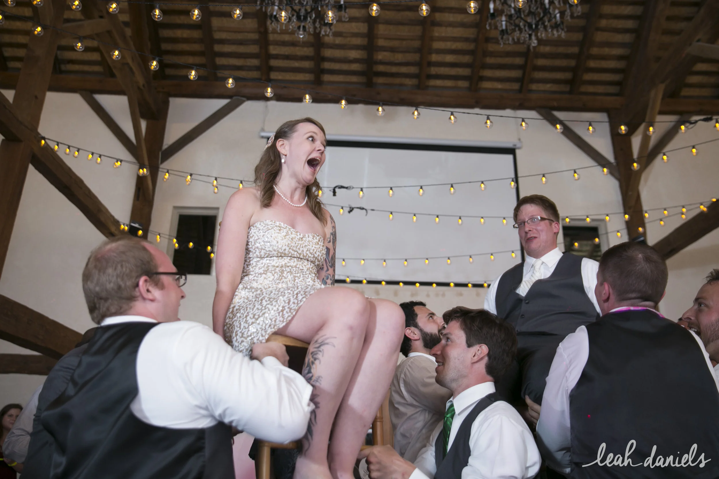 Tiffany and Sasha holding on tight to their chairs during the Hora!