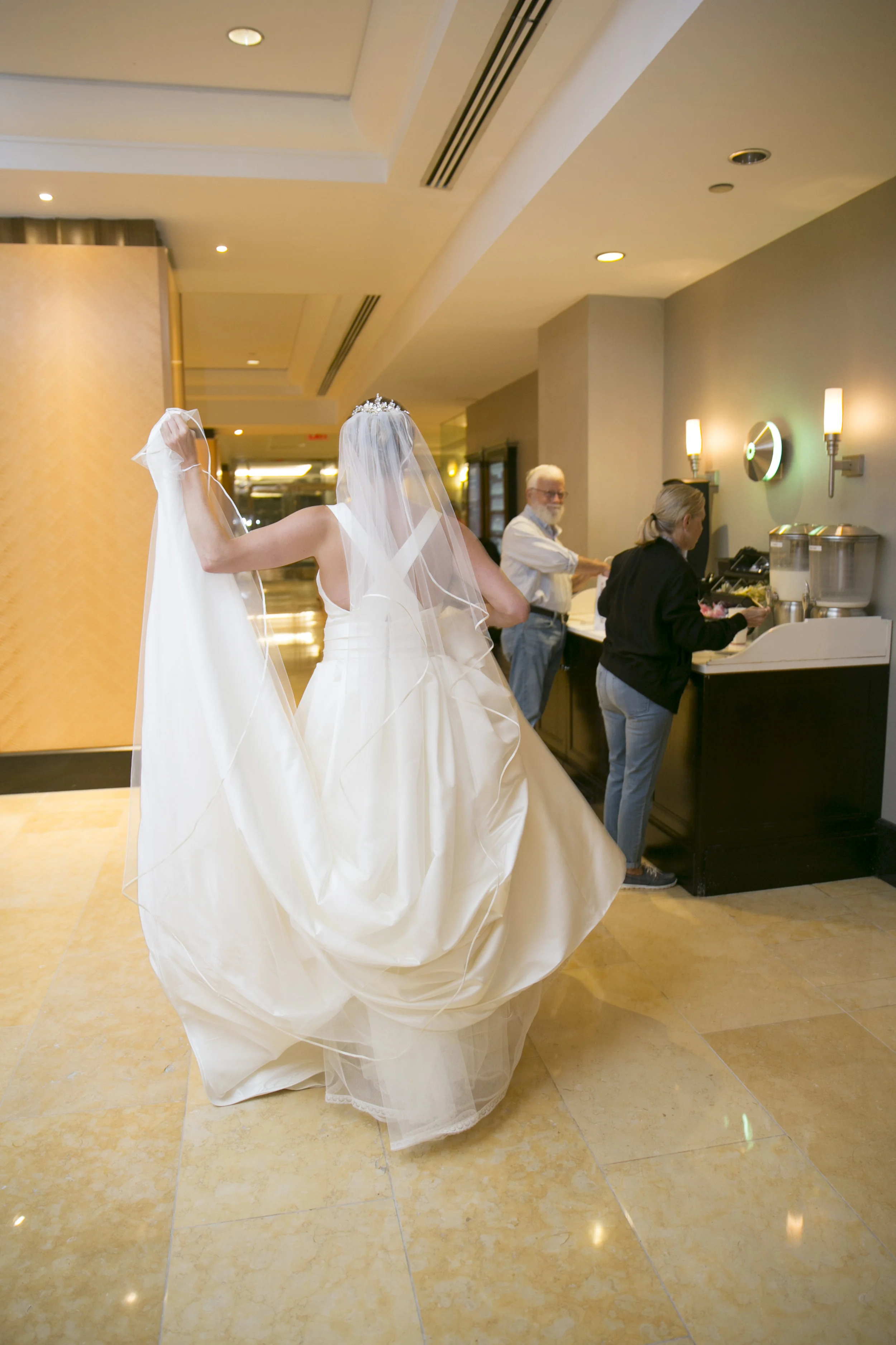The moment when you walk through the hotel lobby in your wedding dress and everyone stops and stares.