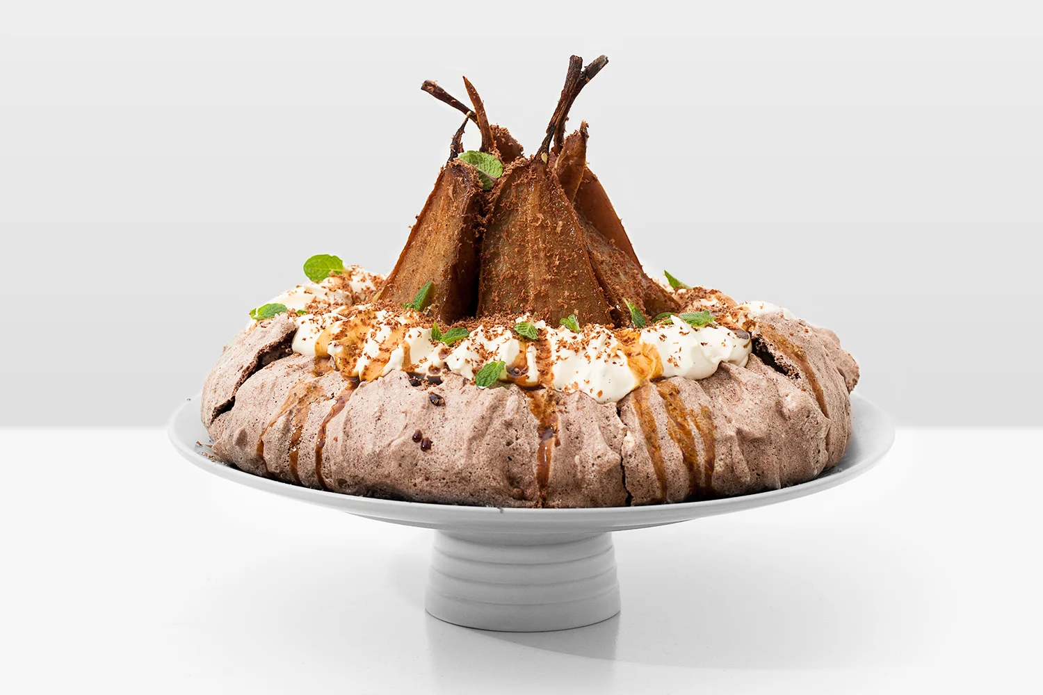 Chocolate Pavlova with Roasted Pears. Recipe and styling by Cle-ann , photo by Hugh Adams .