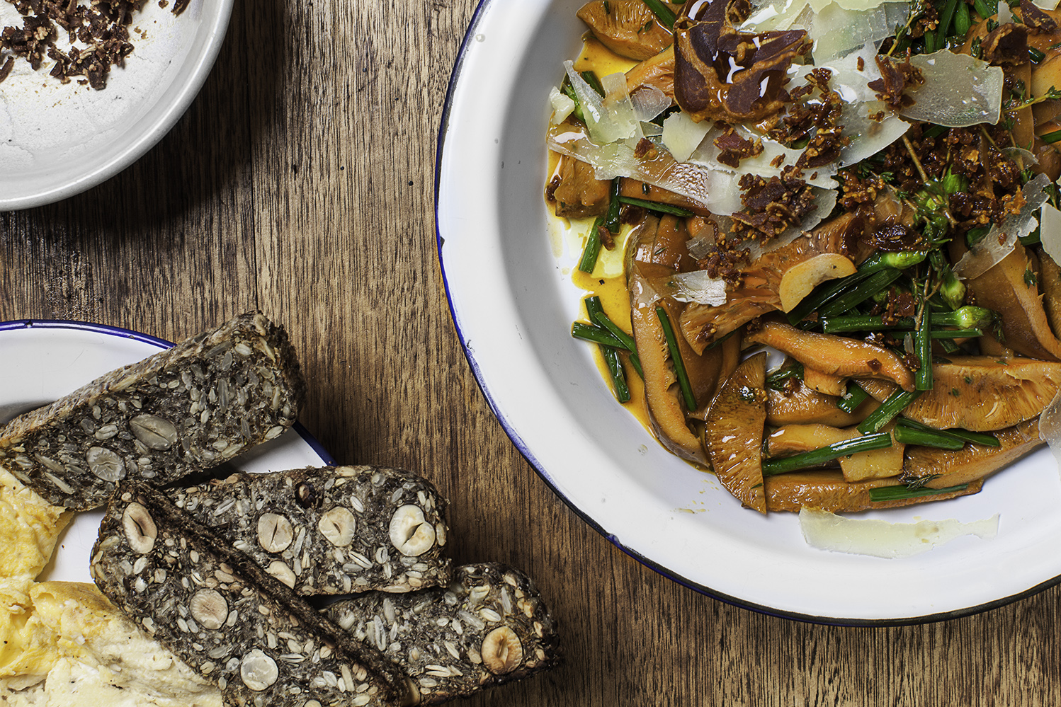 Pine Mushrooms w Garlic Chives, Pecorino and Prosciutto Crumbs. Served with toasted homemade gluten free bread and scrambled eggs. Recipe and styling by Cle-ann , photo by Hugh Adams . 