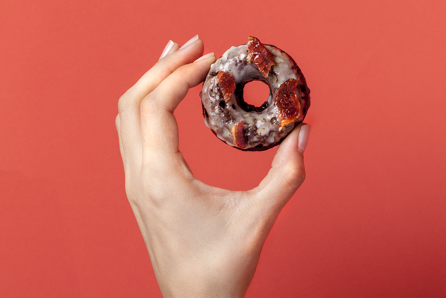 Gluten free baked chocolate doughnut, topped with maple glaze and crispy bacon. Recipe and styling by Cle-ann , photo by Hugh Adams .