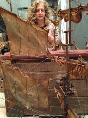 Sharon adjusts the rigging. 