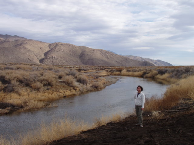 Kristine standing in a prescribed burn area to remove tamarisk along the Owens River