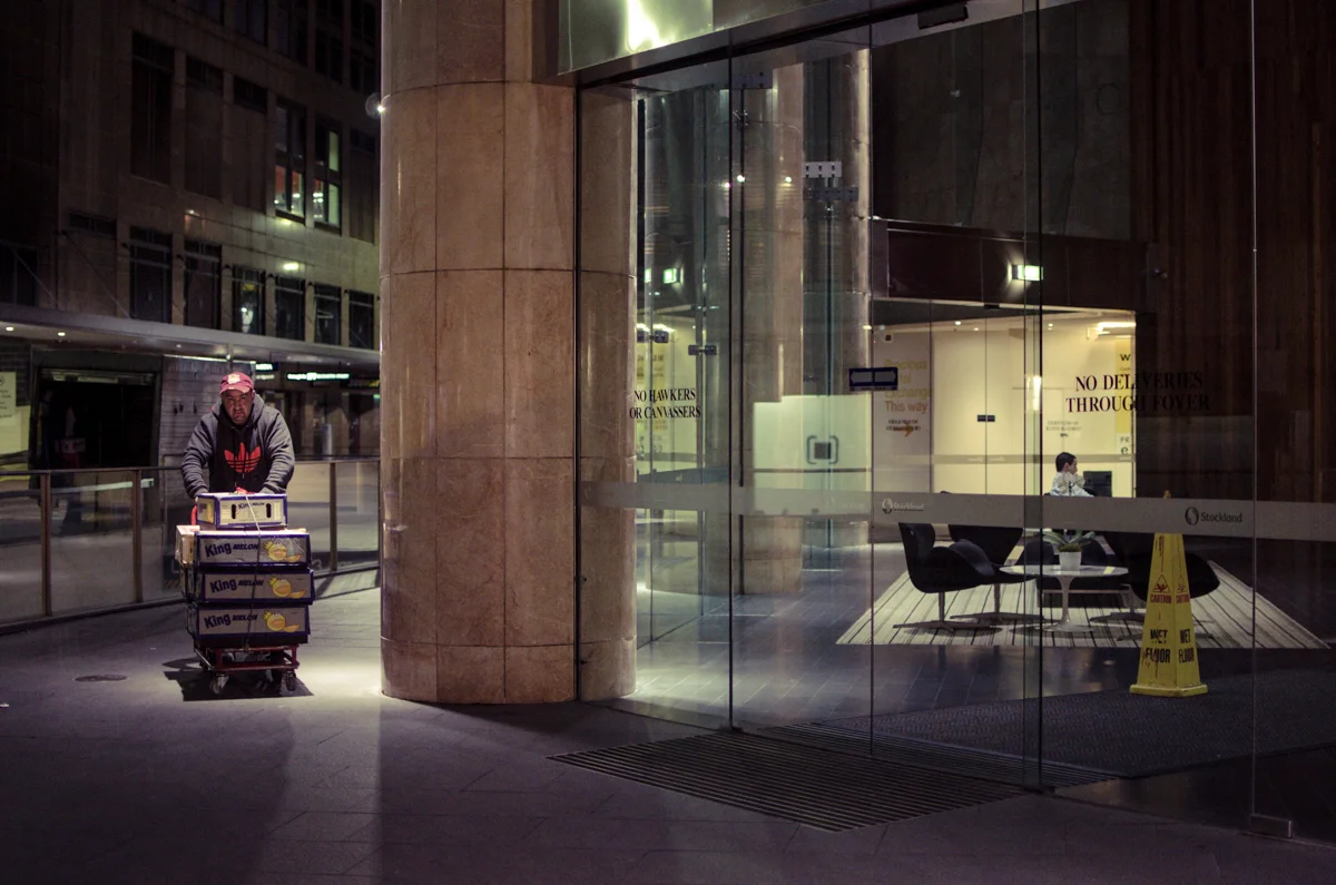 Before sunrise, as
the wheels of commerce begin to turn, a man stocks lunch rooms at the Central
Business District.