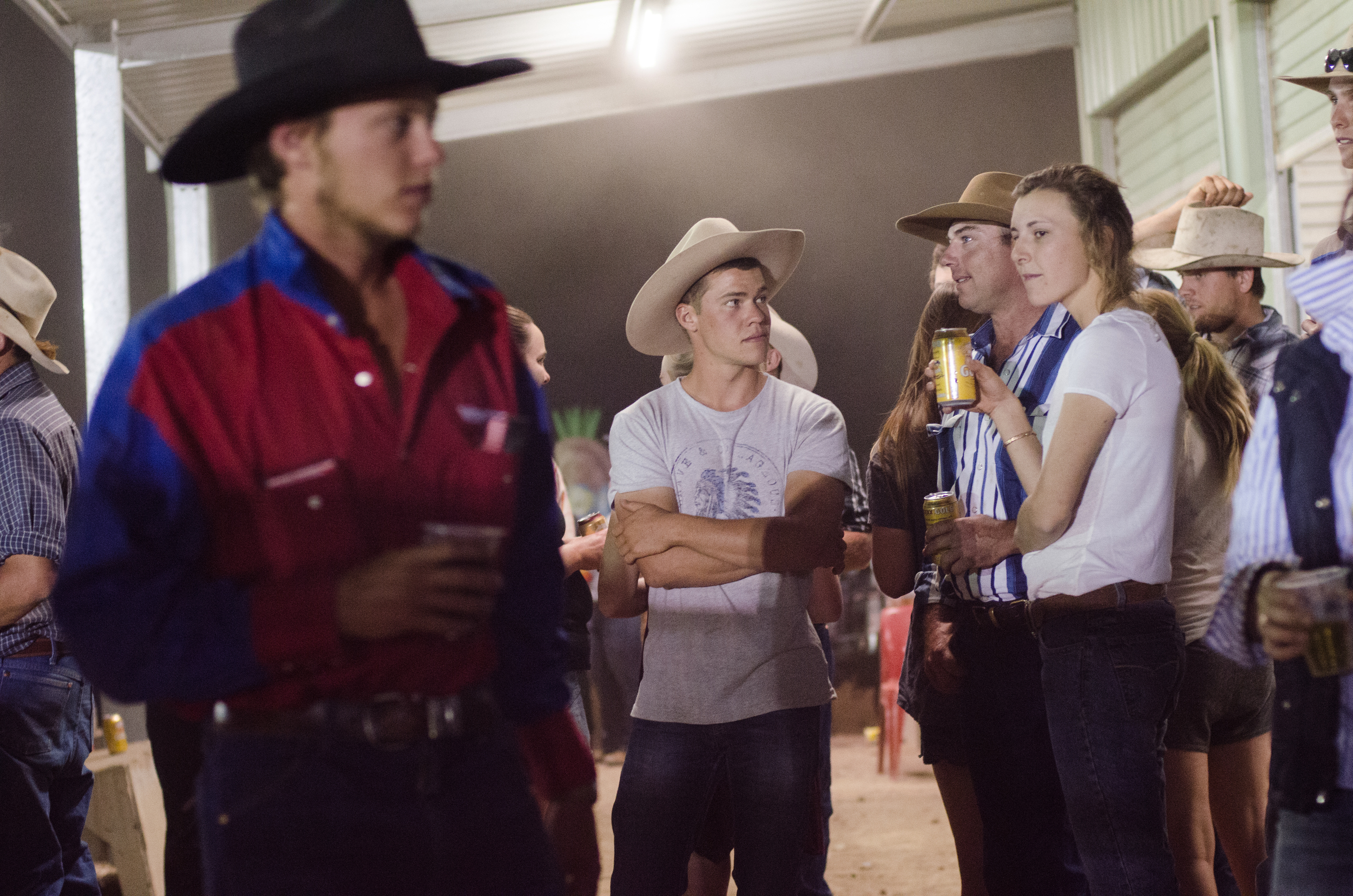 The audience interacts with the competitors by cheering them on and providing them with drinks.
