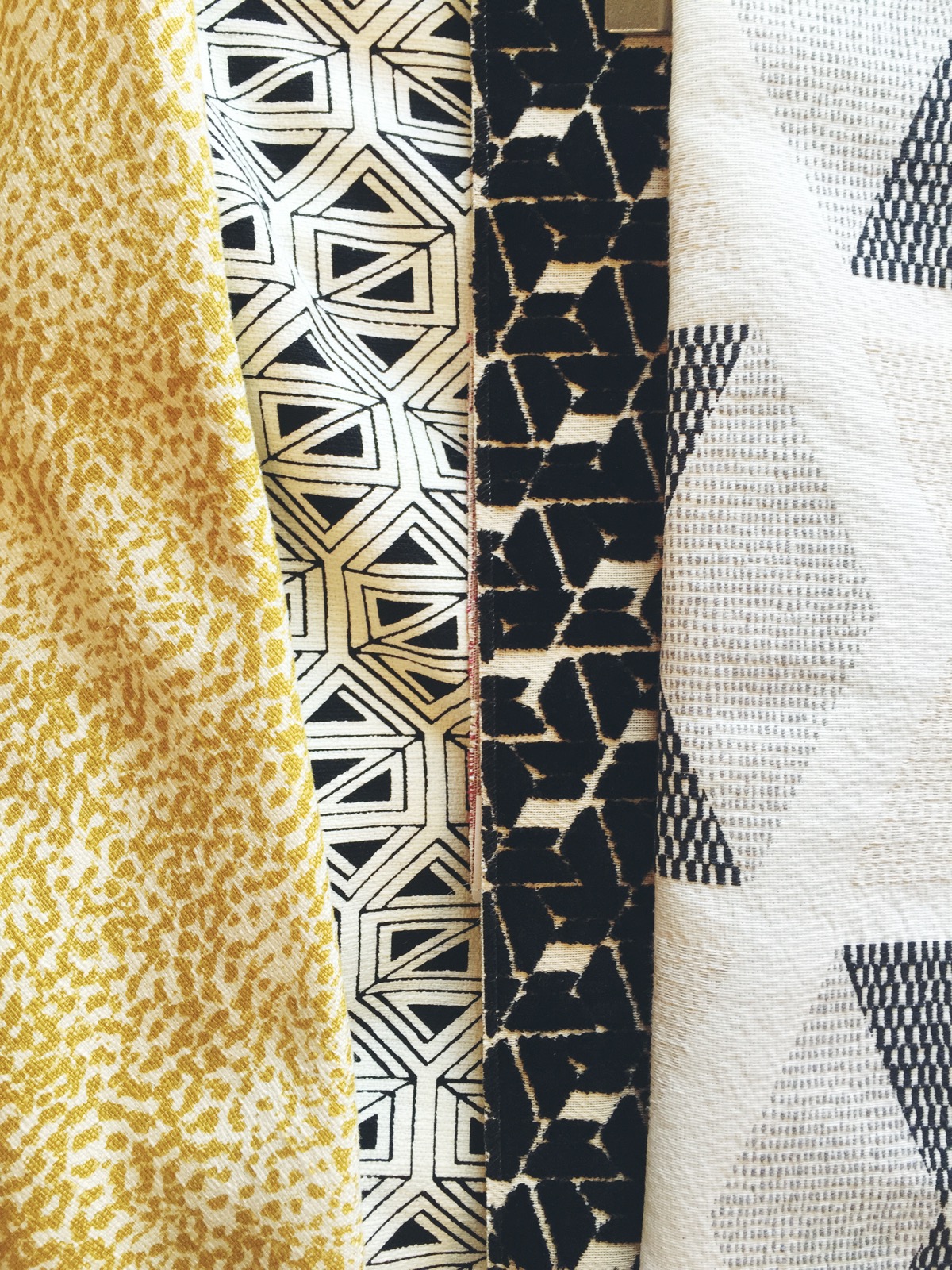 This past weekend my mom and I went to look at fabric for Dean's glider that I'm getting some cushion redone on. His main nursery colors are black, white, and yellow but there will surely be others because let's be honest, I just can't control myself! 