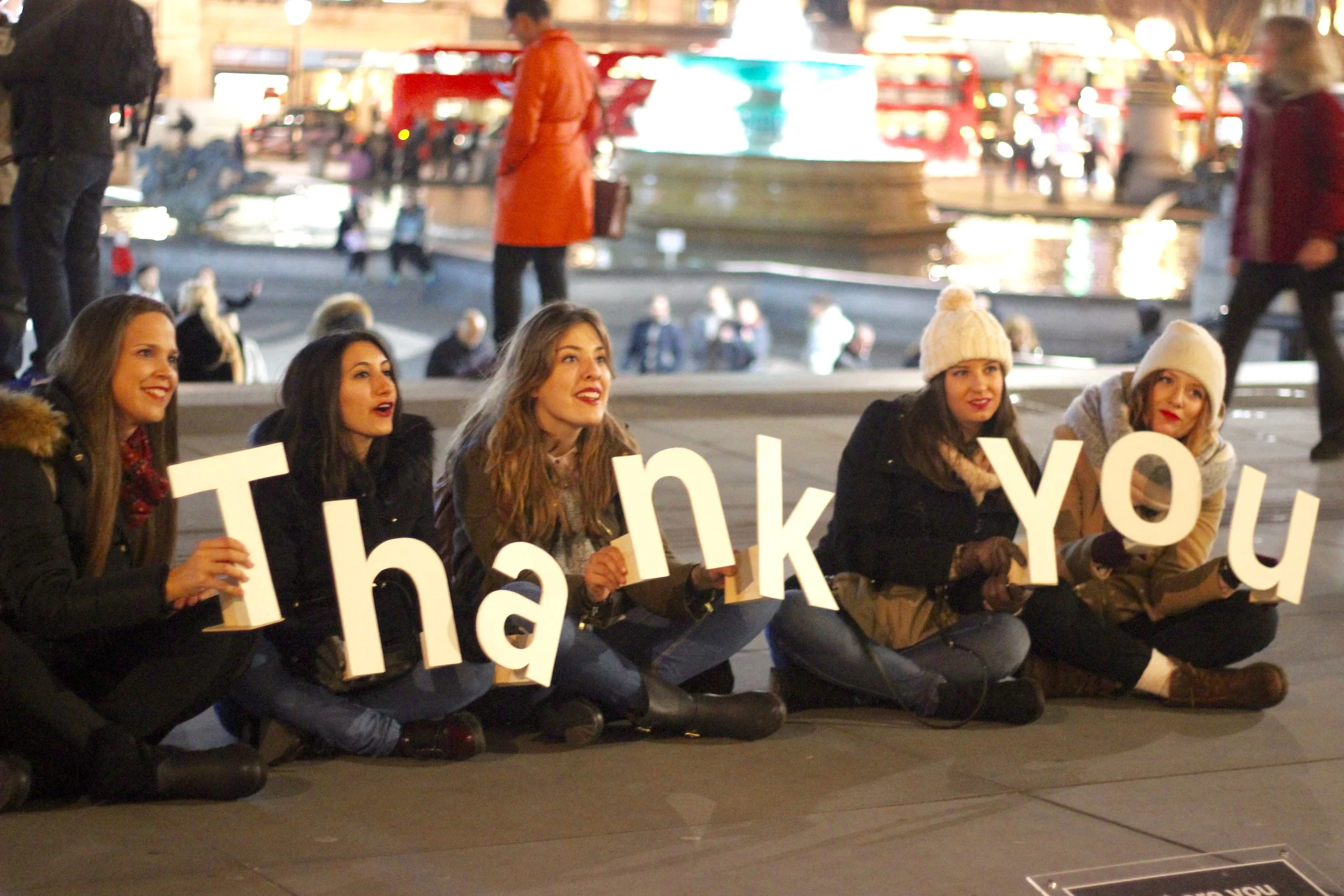 These tourists wanted to pick up the letters for their photo.