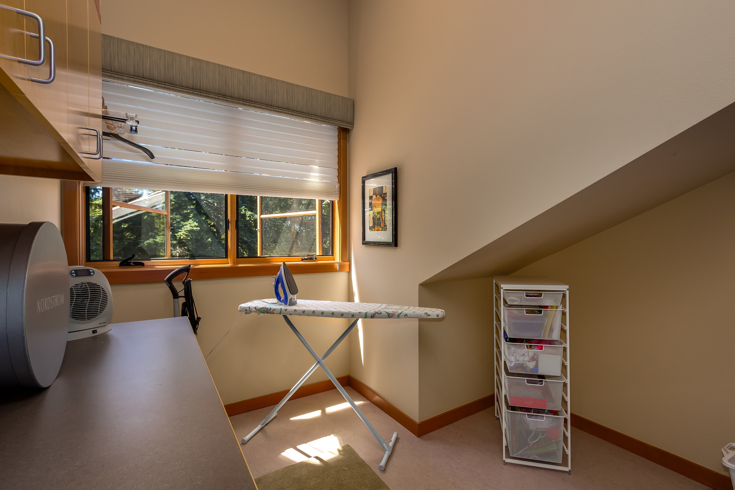This versatile alcove is currently in use as an exercise area. Put a desk here for your office or turn it into a reading nook.