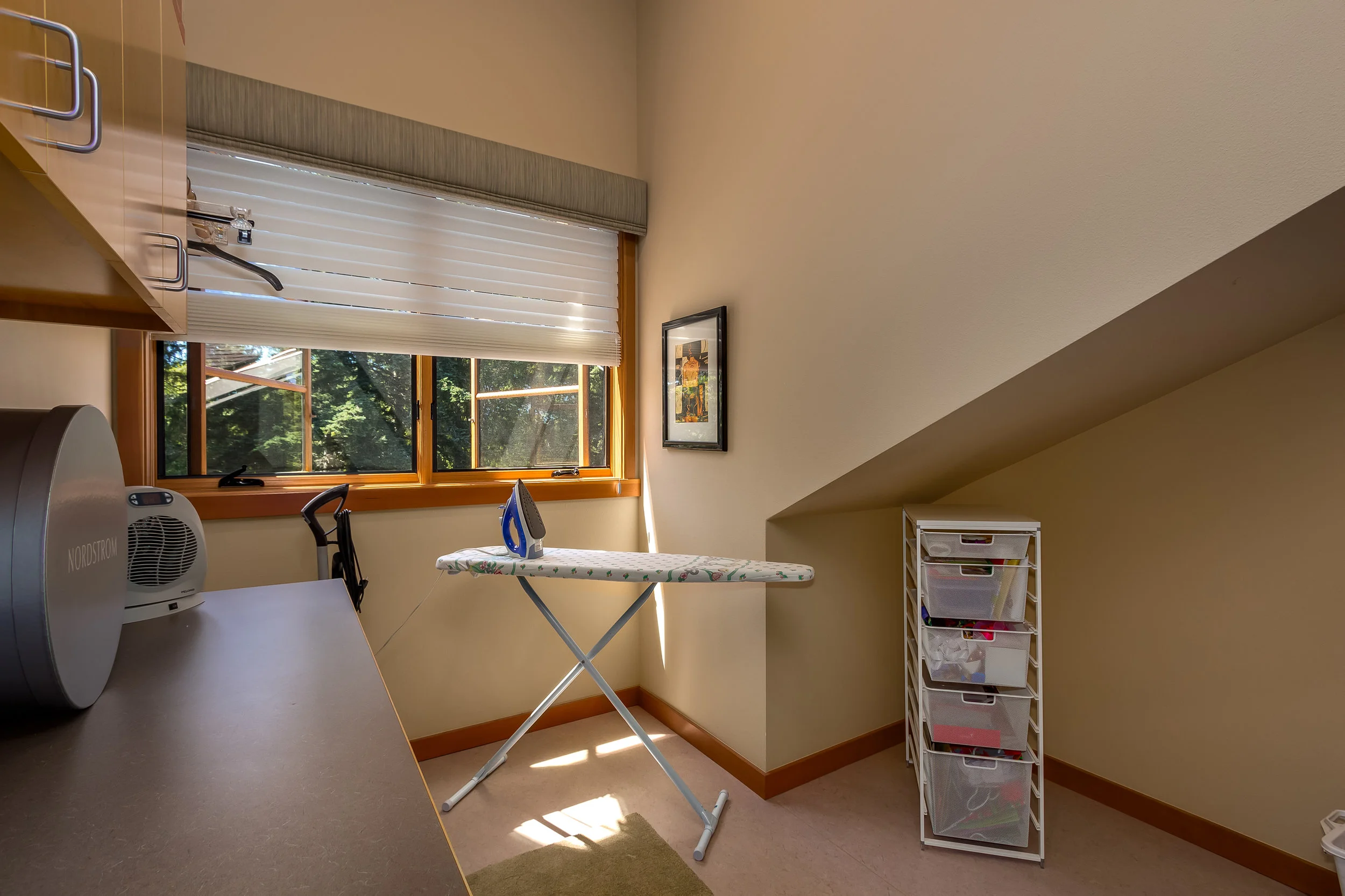 Oversized laundry room will surprise you! You can do all of your laundry needs in here including ironing. No more lugging out the ironing board...just leave it up!
