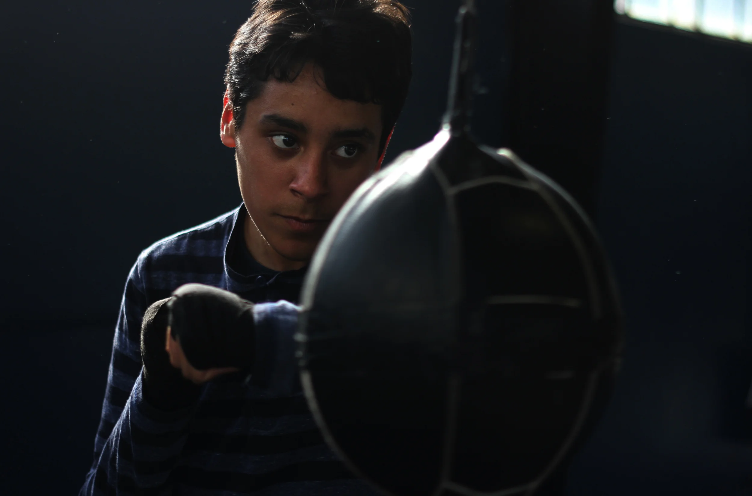  Antonio Munguia, 15, practices his footwork and accuracy alone.&nbsp; 