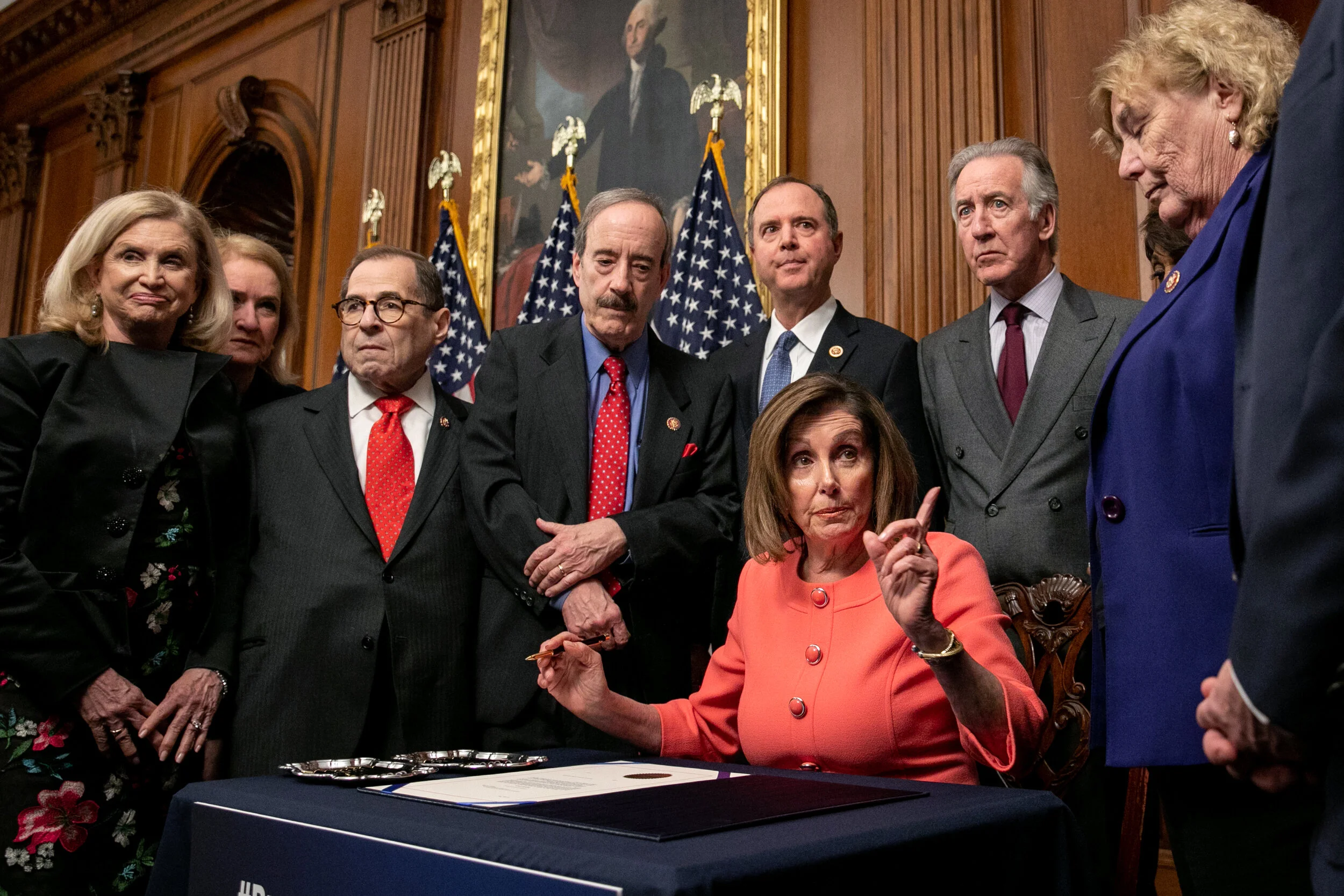  U.S. House Speaker Nancy Pelosi, a Democrat from California, signs articles of impeachment against President Donald Trump during an engrossment ceremony. (Photo made for Bloomberg) 